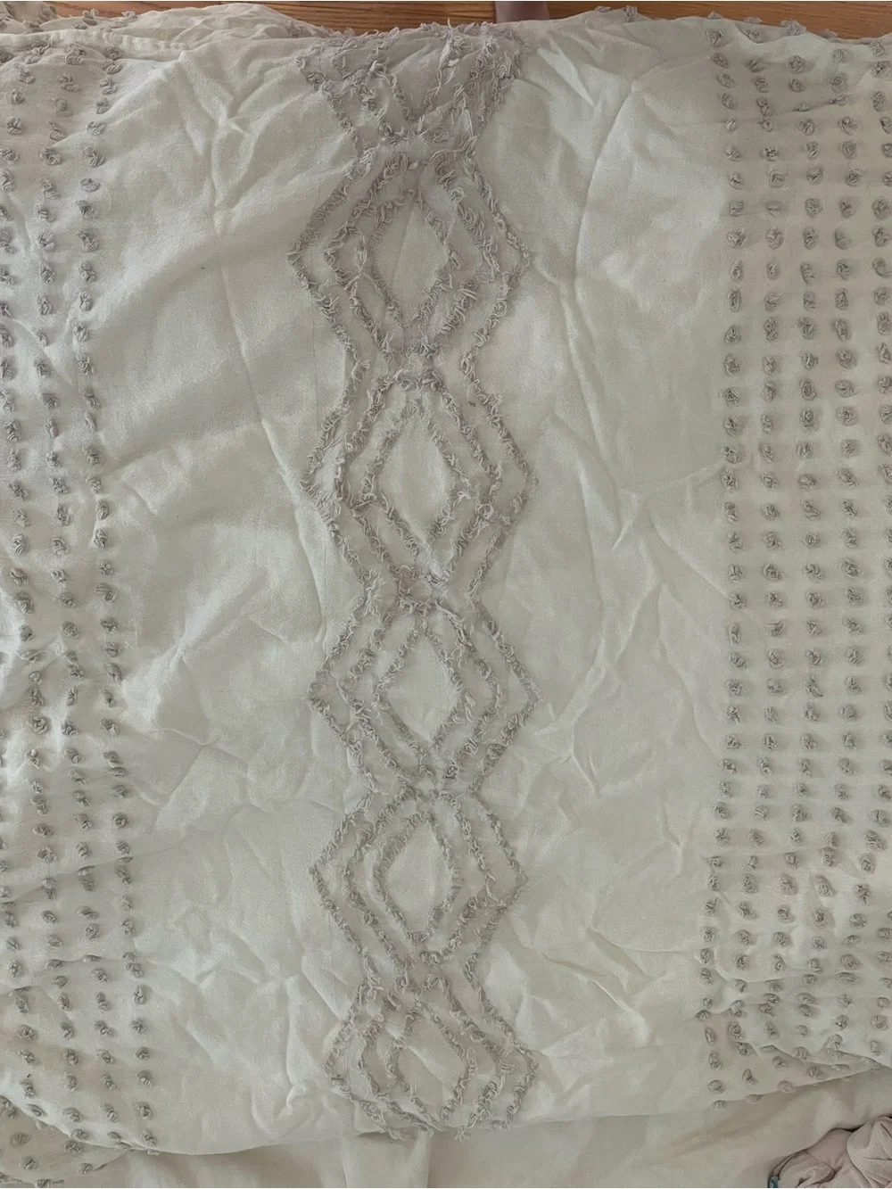 White duvet cover with purple embellishments